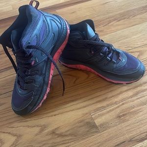 Hoka hiking boots -best hiking shoes ever! No ice slippage -I need to size up.